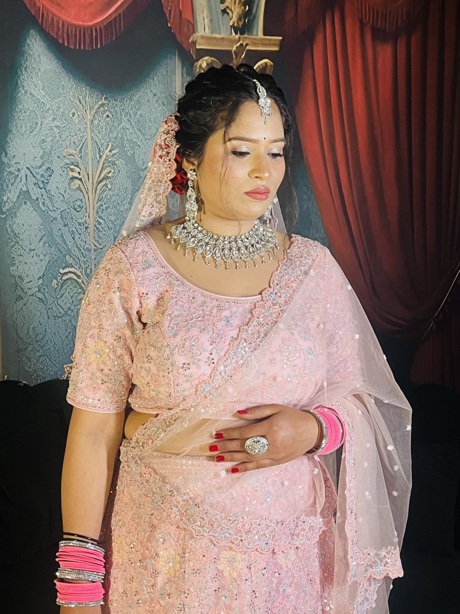 Bridal pink lehenga portrait with silver jewelry