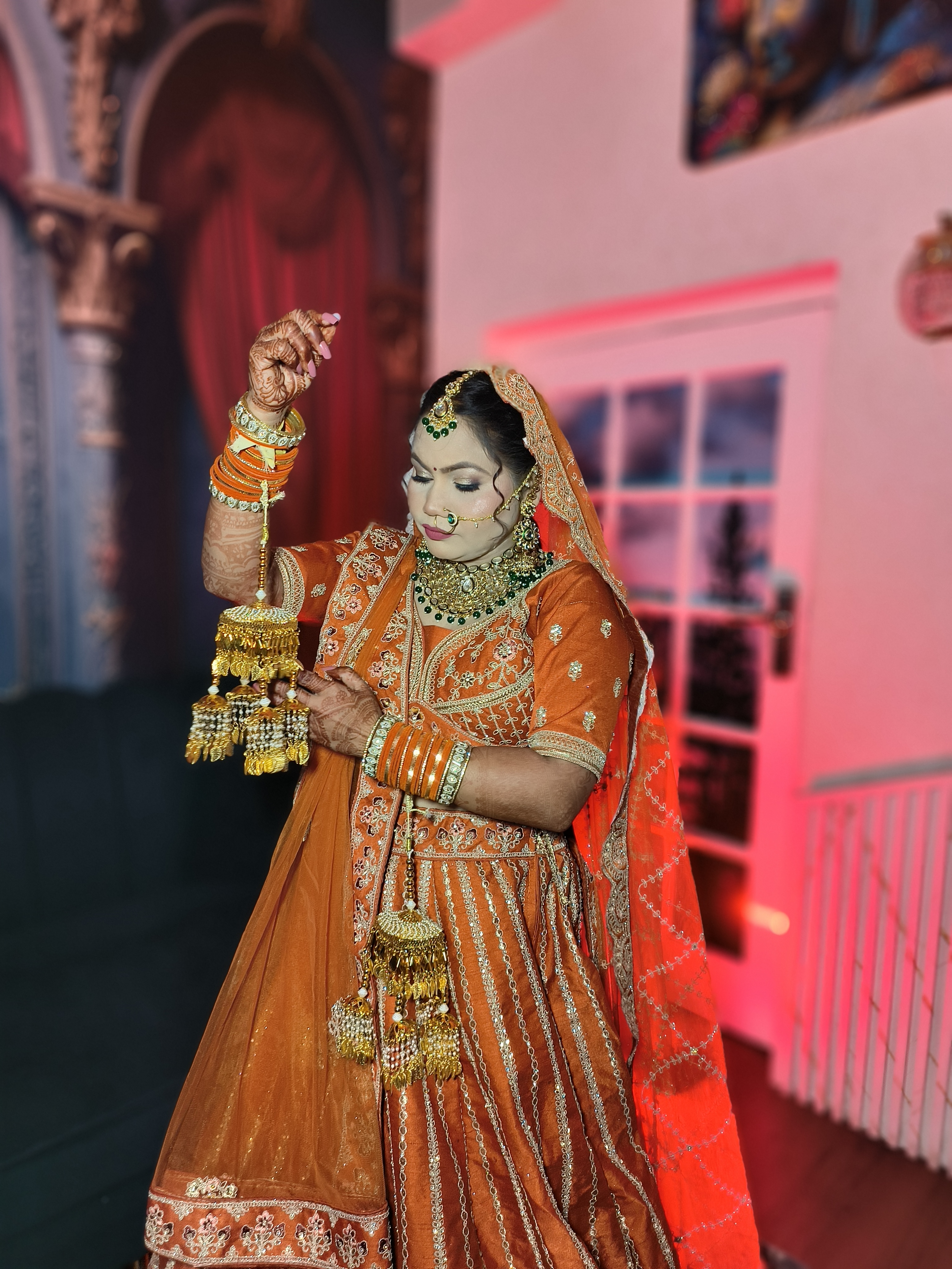 Indian bride with elegant bridal makeup and gold jewelry